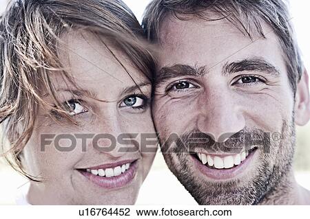 Close up of couple’s smiling faces View Large Photo Image Stock Image - Close up of couple’s smiling faces. Fotosearch