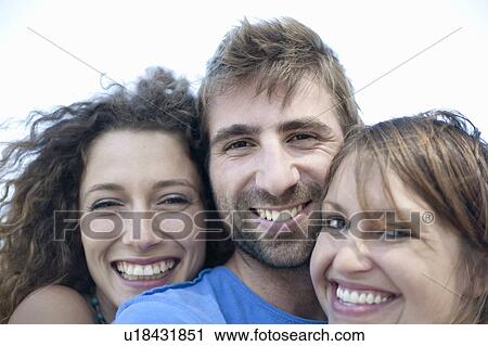 Close up of friends’ smiling faces View Large Photo Image Stock Image - Close up of friends’ smiling faces. Fotosearch