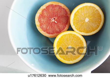Close up of halved citrus fruits View Large Photo Image Stock Image - Close up of halved citrus fruits. Fotosearch