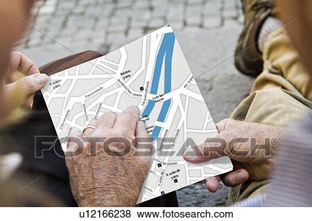 Close up of older couple with city map View Large Photo Image Stock Photo - Close up of older couple with city map. Fotosearch