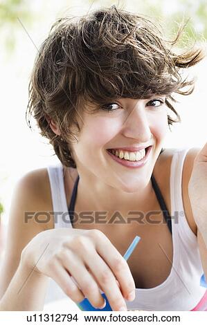 Picture - Close up of smiling woman’s face. Fotosearch