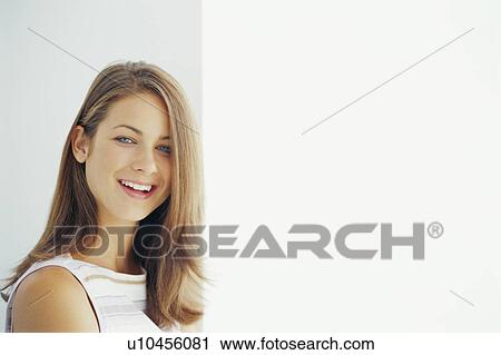 Stock Image - Close up of smiling woman’s face. Fotosearch