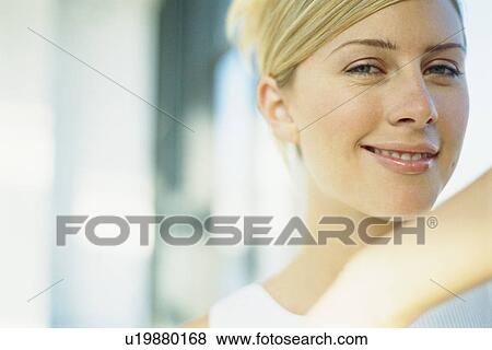Stock Photo - Close up of smiling woman’s face. Fotosearch