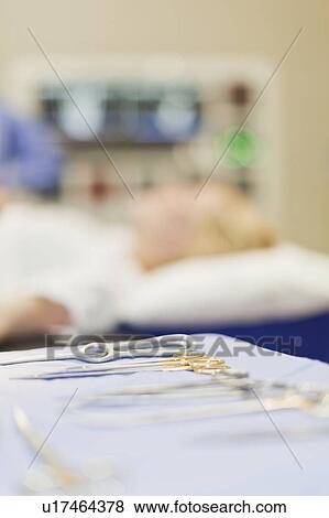 Stock Photo - Close up of surgical tools on mat. Fotosearch