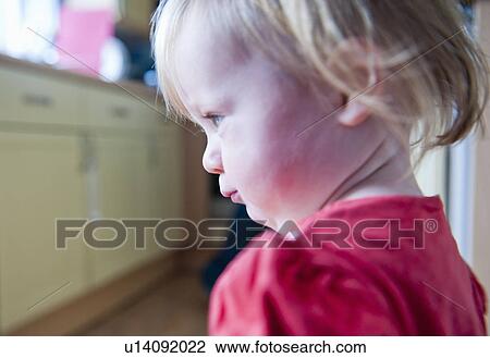Stock Image - Close up of toddler girl’s face. Fotosearch