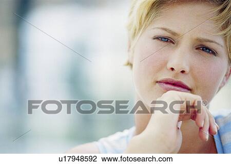Close up of woman’s curious face View Large Photo Image Stock Image - Close up of woman’s curious face. Fotosearch