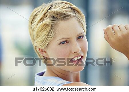 Stock Image - Close up of woman’s face. Fotosearch