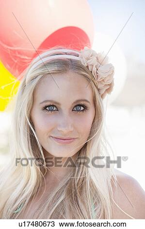 Stock Image - Close up of woman’s smiling face. Fotosearch