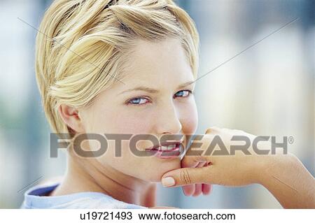 Stock Image - Close up of woman’s smiling face. Fotosearch
