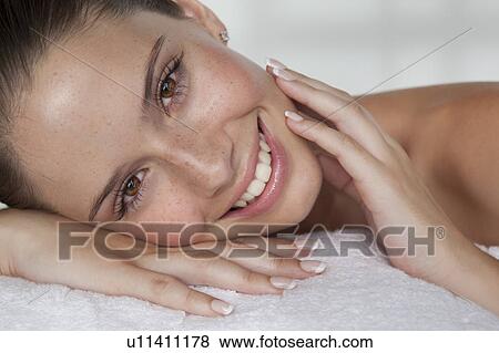 Stock Photo - Close up of woman's smiling face. Fotosearch