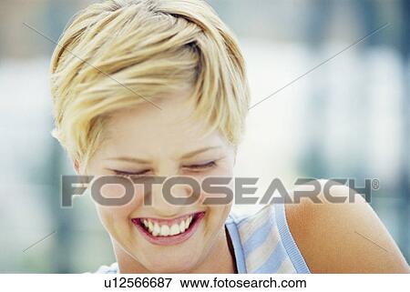 Stock Photo - Close up of woman’s smiling face. Fotosearch