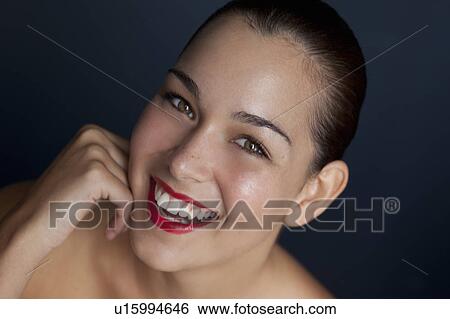 Stock Photograph - Close up of woman's smiling face. Fotosearch