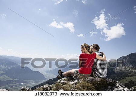 Stock Image - Couple admiring rural landscape. Fotosearch