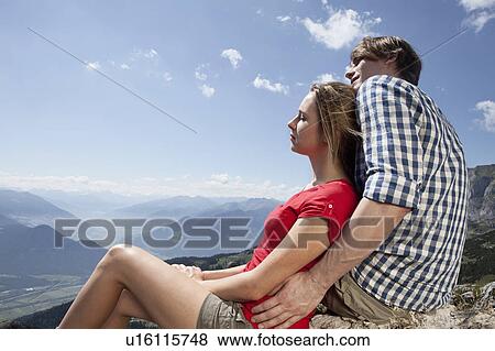 Couple admiring rural landscape View Large Photo Image Stock Photo - Couple admiring rural landscape. Fotosearch