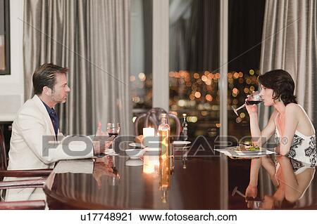 Couple having romantic dinner at home View Large Photo Image Stock Image - Couple having romantic dinner at home. Fotosearch