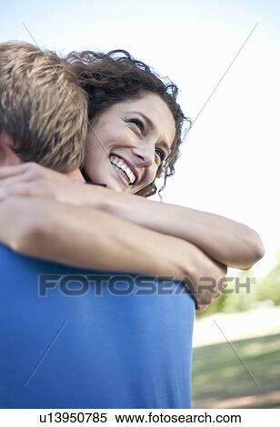 Couple hugging in park View Large Photo Image Stock Photography - Couple hugging in park. Fotosearch