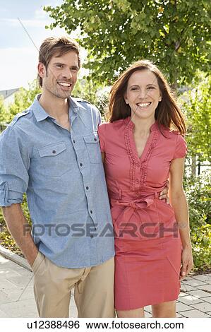 Couple hugging outdoors View Large Photo Image Stock Photograph - Couple hugging outdoors. Fotosearch