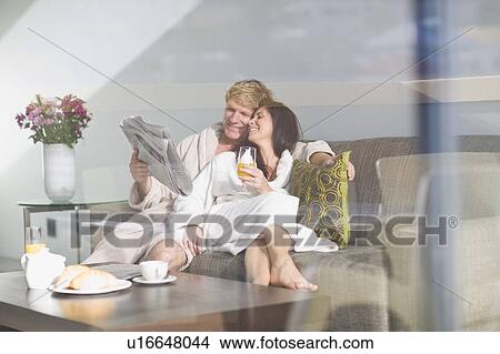 Couple in bathrobes having breakfast View Large Photo Image Picture - Couple in bathrobes having breakfast. Fotosearch