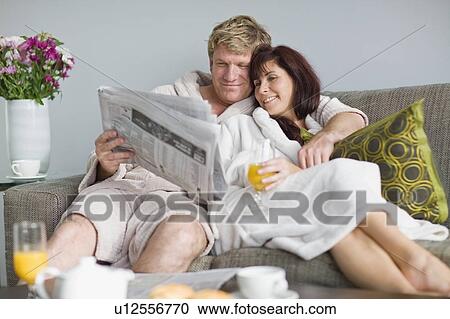 Couple in bathrobes having breakfast View Large Photo Image Stock Image - Couple in bathrobes having breakfast. Fotosearch