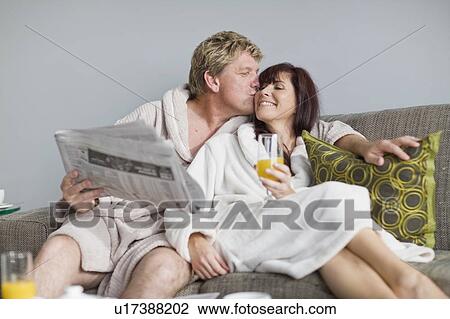 Couple in bathrobes having breakfast View Large Photo Image Stock Image - Couple in bathrobes having breakfast. Fotosearch