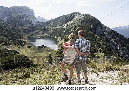 Stock Image - Couple overlooking rural landscape. Fotosearch