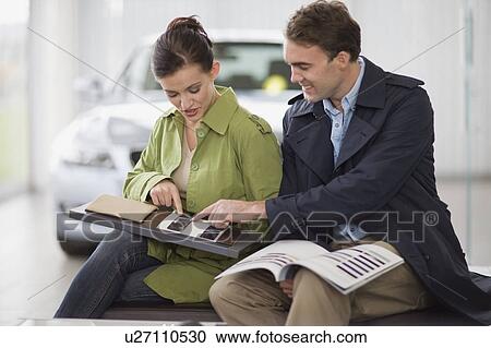 Couple picking out swatches in showroom View Large Photo Image Stock Image - Couple picking out swatches in showroom. Fotosearch