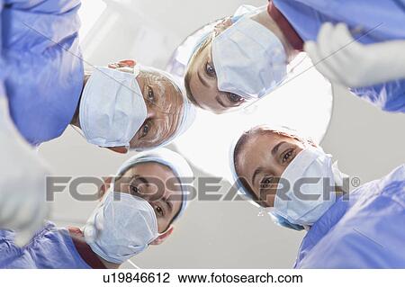 Doctors examining patient on table View Large Photo Image Stock Image - Doctors examining patient on table. Fotosearch