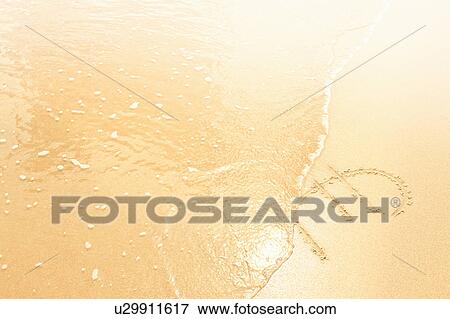 Euro symbol in sand washed away by waves View Large Photo Image Stock Photo - Euro symbol in sand washed away by waves. Fotosearch
