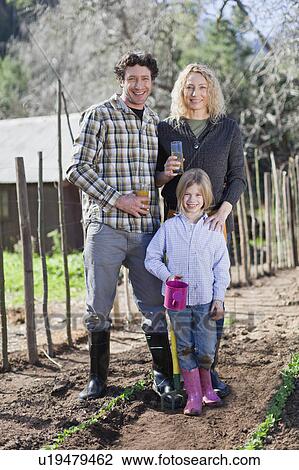 Family drinking juice and gardening View Large Photo Image Stock Image - Family drinking juice and gardening. Fotosearch