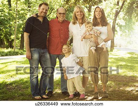 Family standing together outdoors View Large Photo Image Stock Photo - Family standing together outdoors. Fotosearch