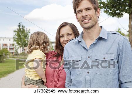 Stock Photography - Family standing together outdoors. Fotosearch