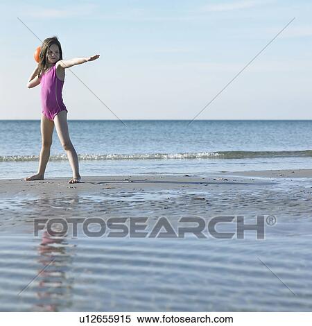 Girl playing with ball on beach View Large Photo Image Stock Photography - Girl playing with ball on beach. Fotosearch
