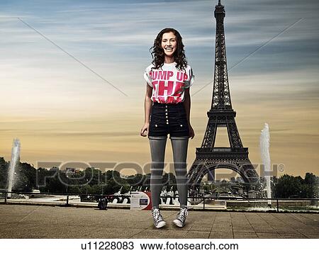 Girl standing in front of Eiffel Tower View Large Photo Image Stock Image - Girl standing in front of Eiffel Tower. Fotosearch