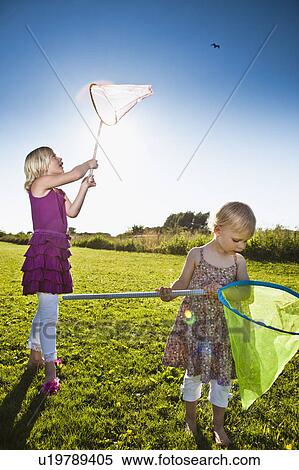 Girls playing with butterfly nets View Large Photo Image Stock Photography - Girls playing with butterfly nets. Fotosearch