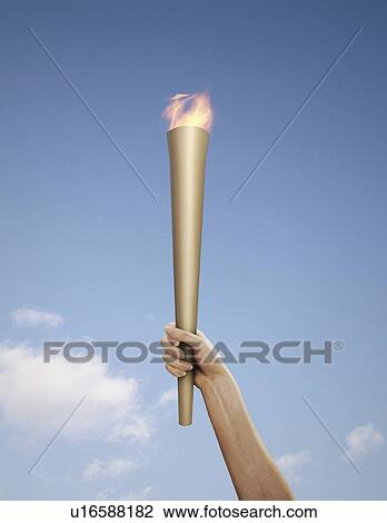 Hand holding flaming baton View Large Photo Image Stock Image - Hand holding flaming baton. Fotosearch
