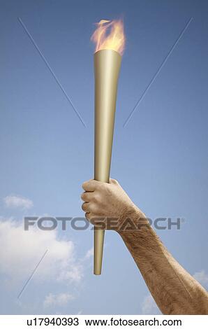 Hand holding flaming baton View Large Photo Image Stock Image - Hand holding flaming baton. Fotosearch