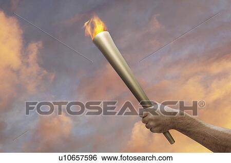 Hand holding flaming baton View Large Photo Image Stock Photograph - Hand holding flaming baton. Fotosearch