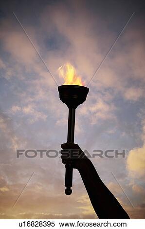 Hand holding flaming baton View Large Photo Image Stock Photography - Hand holding flaming baton. Fotosearch