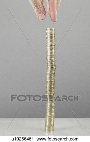 Man making stack of coins View Large Photo Image Stock Image - Man making stack of coins. Fotosearch