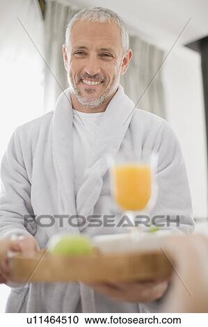 Man serving breakfast in bed View Large Photo Image Stock Image - Man serving breakfast in bed. Fotosearch
