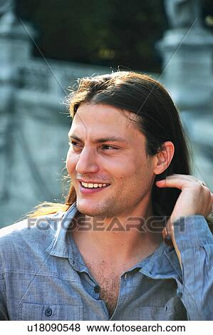Stock Photo - Man smiling outdoors. Fotosearch