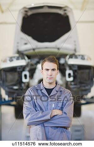 Mechanic standing with arms crossed View Large Photo Image Stock Photograph - Mechanic standing with arms crossed. Fotosearch