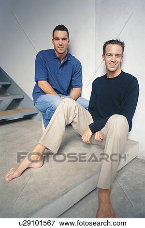 Men relaxing on steps View Large Photo Image Stock Photo - Men relaxing on steps. Fotosearch