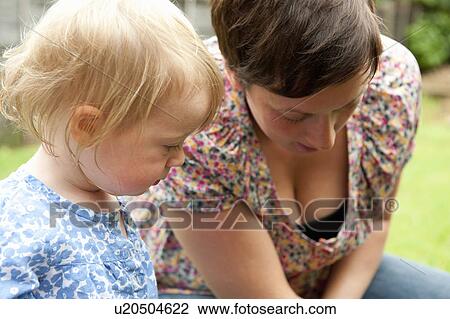 Mother and daughter gardening View Large Photo Image Stock Image - Mother and daughter gardening. Fotosearch