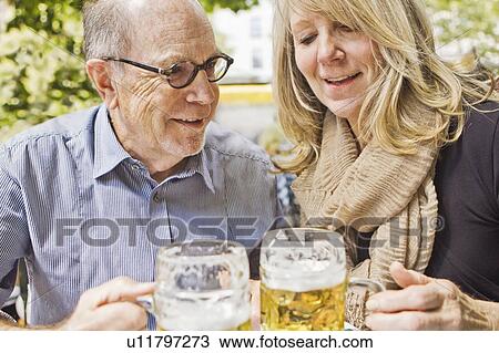 Older couple drinking beer together View Large Photo Image Stock Image - Older couple drinking beer together. Fotosearch