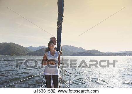 Older couple relaxing on sailboat View Large Photo Image Stock Image - Older couple relaxing on sailboat. Fotosearch