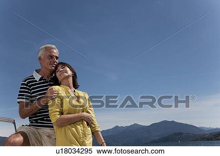 Older couple relaxing outdoors View Large Photo Image Stock Photography - Older couple relaxing outdoors. Fotosearch