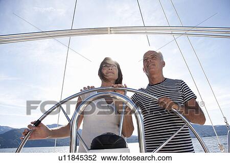 Older couple sailing together View Large Photo Image Stock Image - Older couple sailing together. Fotosearch
