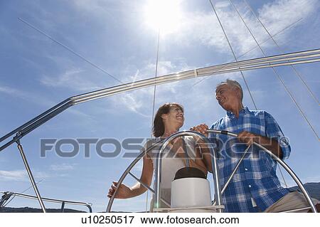 Older couple sailing together View Large Photo Image Stock Photo - Older couple sailing together. Fotosearch