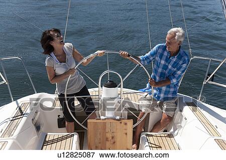Older couple sailing together View Large Photo Image Stock Photo - Older couple sailing together. Fotosearch